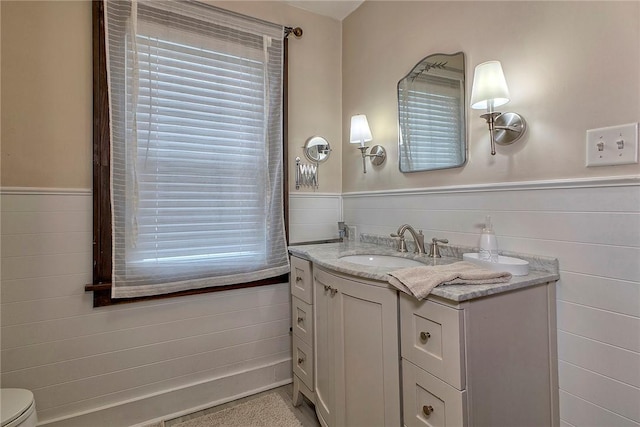 bathroom featuring toilet and vanity