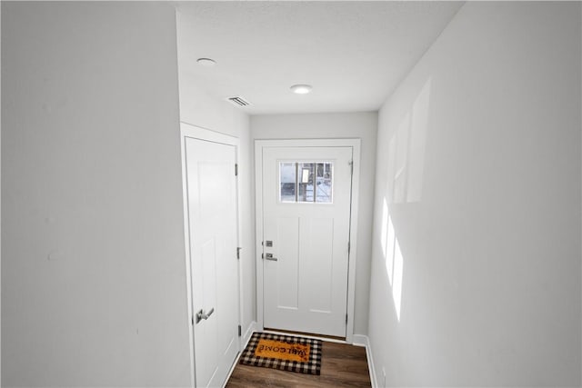 doorway to outside with hardwood / wood-style flooring