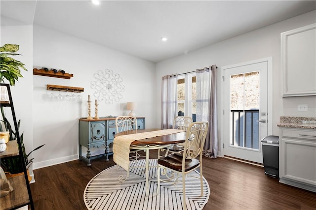 dining area with dark hardwood / wood-style flooring