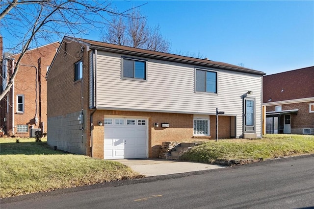 2507 Spinneweber St, Overbrook, PA 15227 - view of front of property featuring a garage and a front lawn