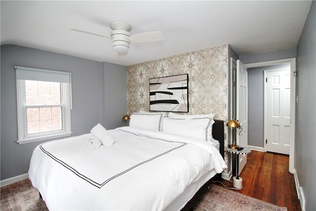 bedroom featuring dark wood-type flooring and ceiling fan