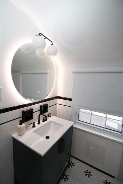 bathroom featuring tile walls and vanity