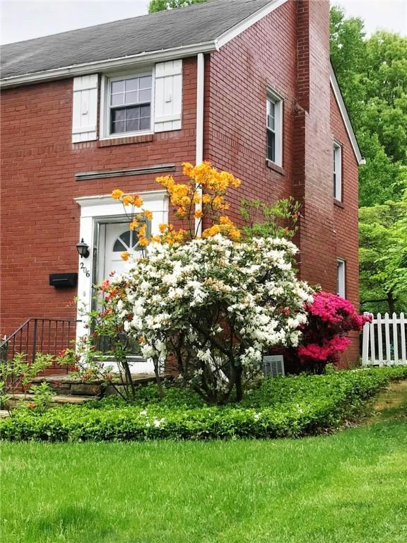 view of home's exterior with a lawn