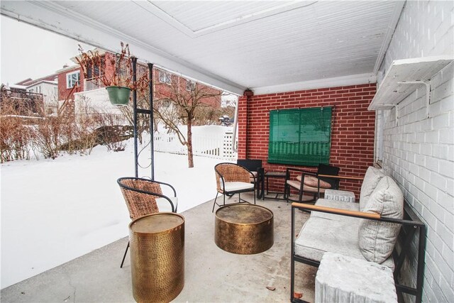 view of snow covered patio