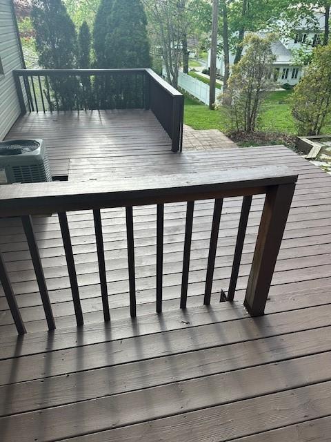 wooden deck with central AC unit