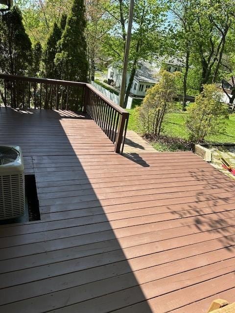 wooden deck with central AC unit