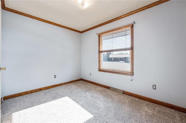 carpeted empty room with crown molding