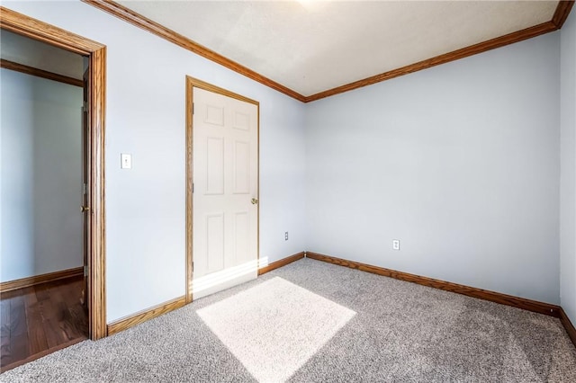 unfurnished bedroom featuring ornamental molding and carpet