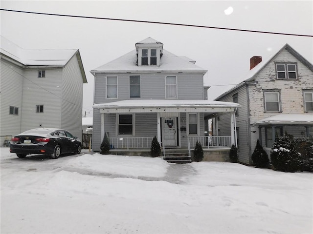 view of property with a porch