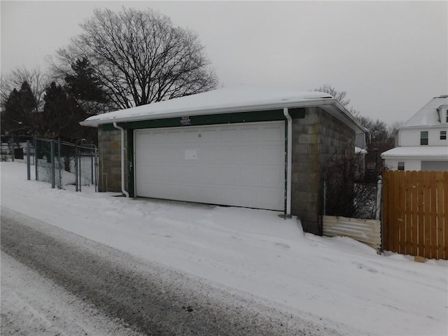 view of snow covered garage