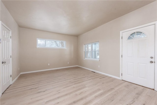 entrance foyer with light hardwood / wood-style flooring