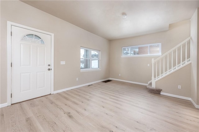 entrance foyer with light hardwood / wood-style floors