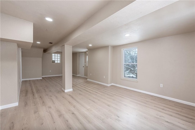 basement featuring light hardwood / wood-style floors