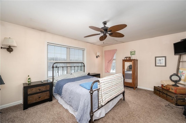 bedroom with ceiling fan and light colored carpet