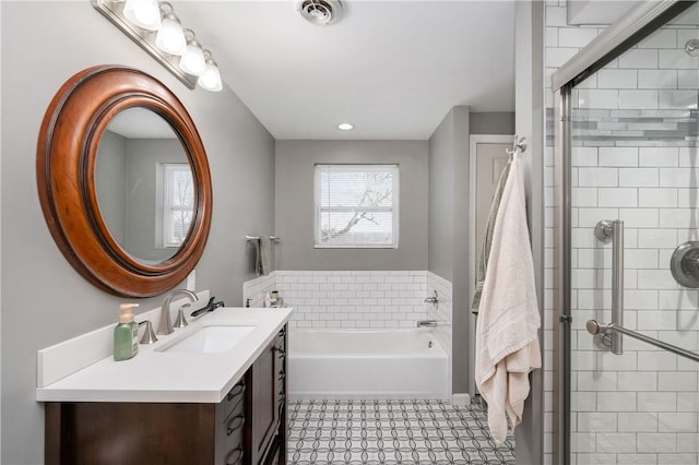 bathroom with vanity and independent shower and bath