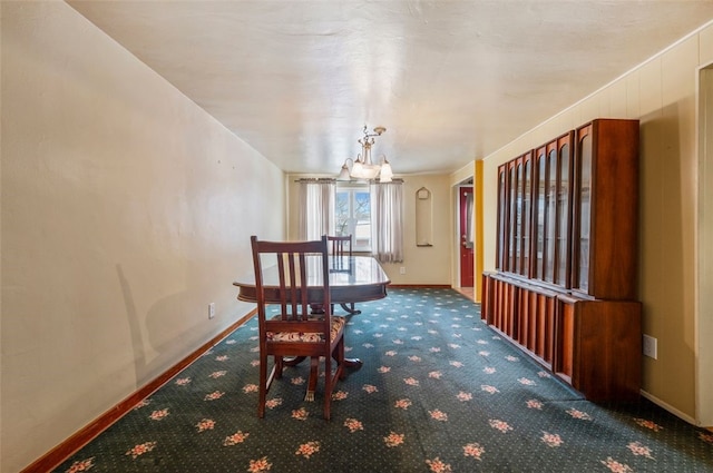 unfurnished dining area featuring carpet floors and a notable chandelier