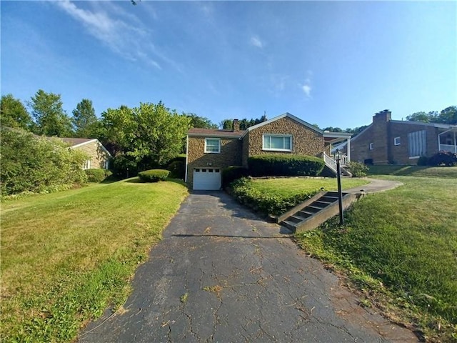 single story home with a garage and a front lawn