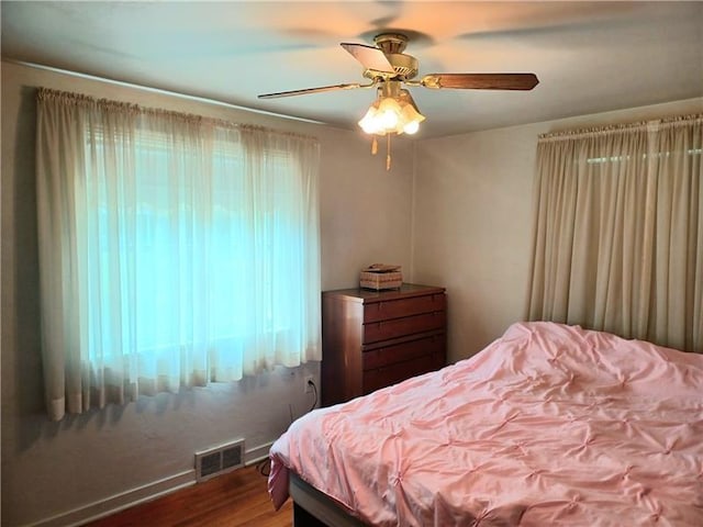 bedroom featuring ceiling fan and hardwood / wood-style flooring