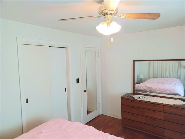 bedroom with ceiling fan and dark hardwood / wood-style flooring