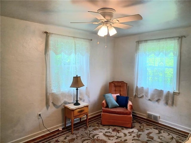 sitting room with ceiling fan