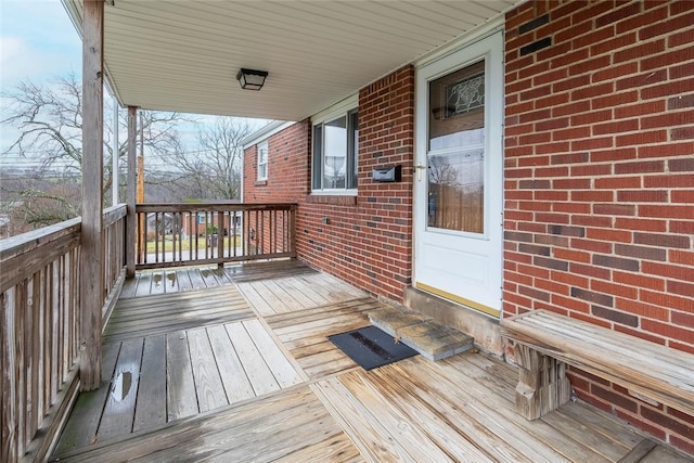 wooden deck featuring covered porch