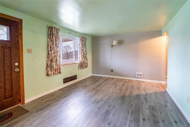 foyer entrance featuring hardwood / wood-style floors