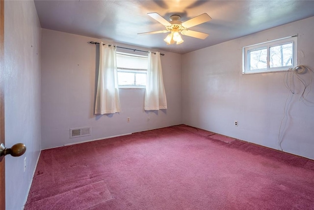 unfurnished room featuring carpet floors, ceiling fan, and plenty of natural light