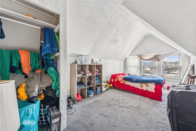 carpeted bedroom featuring vaulted ceiling and a textured ceiling