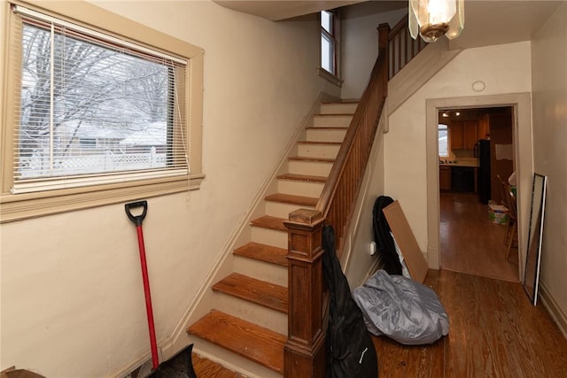 stairway featuring hardwood / wood-style floors