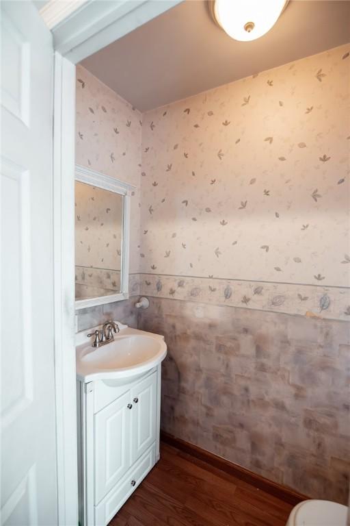 bathroom featuring vanity and hardwood / wood-style floors