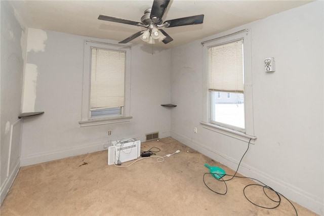 carpeted empty room with ceiling fan