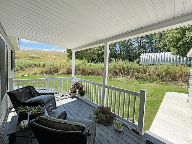 wooden deck with a lawn