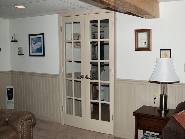 interior space featuring french doors and carpet flooring