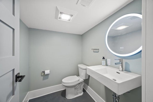 bathroom with toilet and sink