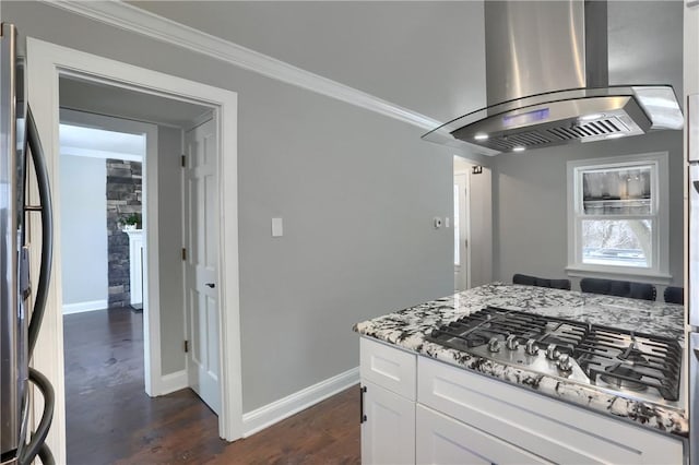 kitchen with white cabinetry, island exhaust hood, stainless steel appliances, dark hardwood / wood-style flooring, and light stone counters