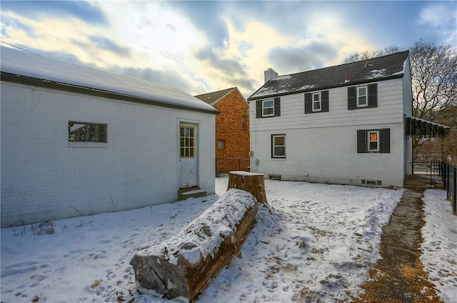 view of snow covered property