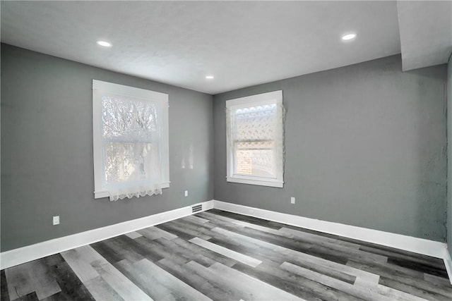 empty room featuring wood-type flooring