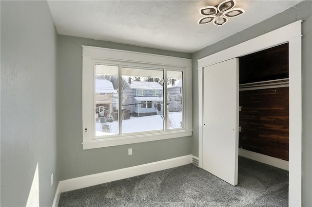 unfurnished bedroom featuring a closet and carpet