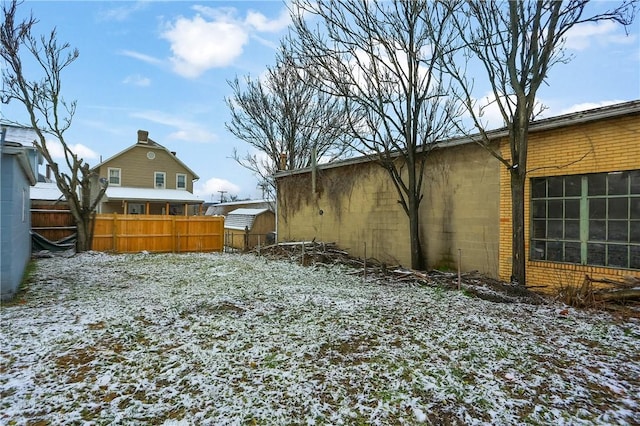 view of yard layered in snow