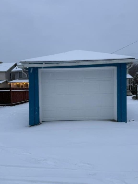 view of snow covered garage