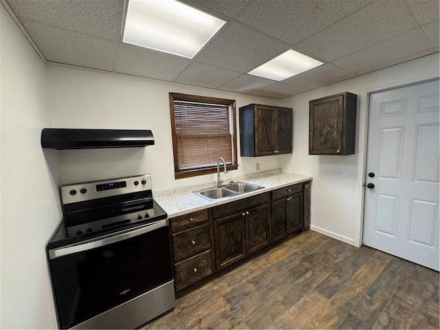 kitchen featuring sink, extractor fan, dark brown cabinetry, and stainless steel electric range