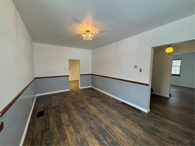 unfurnished room featuring dark hardwood / wood-style flooring