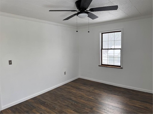 spare room with ceiling fan, dark wood-type flooring, and crown molding