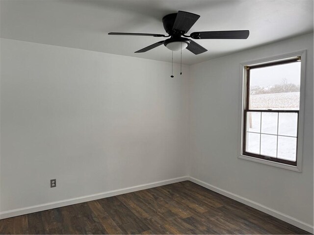 unfurnished room featuring ceiling fan and dark hardwood / wood-style flooring