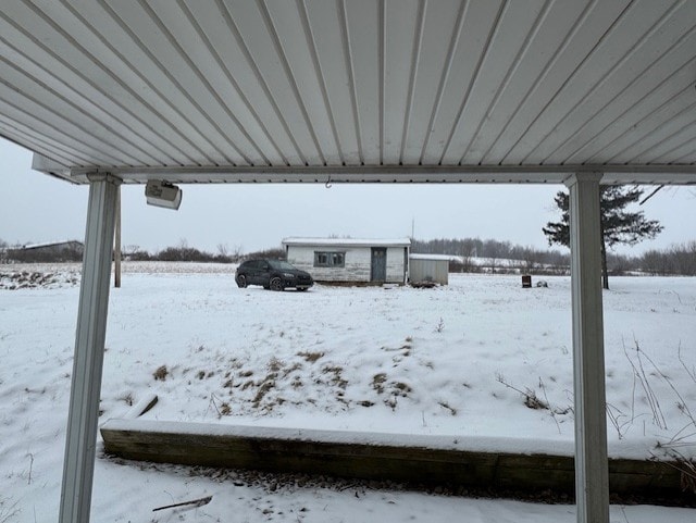 view of yard layered in snow