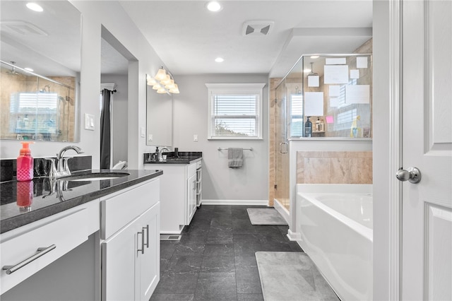 bathroom with plus walk in shower and vanity