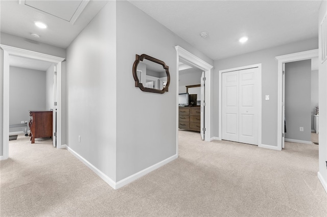 corridor with light colored carpet