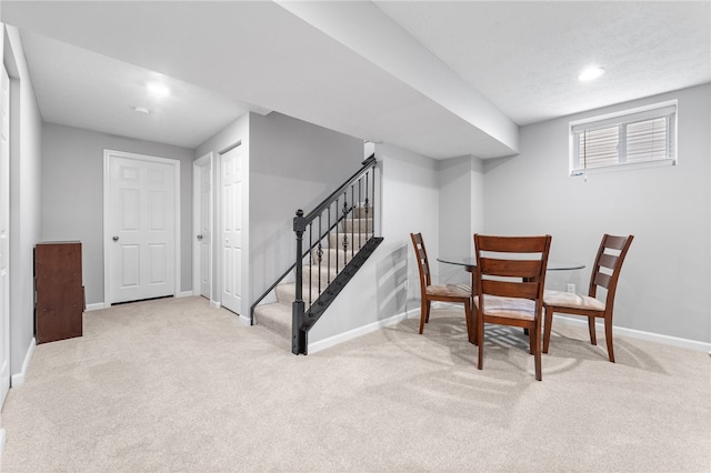 interior space featuring light colored carpet