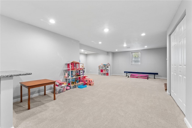 rec room with light carpet