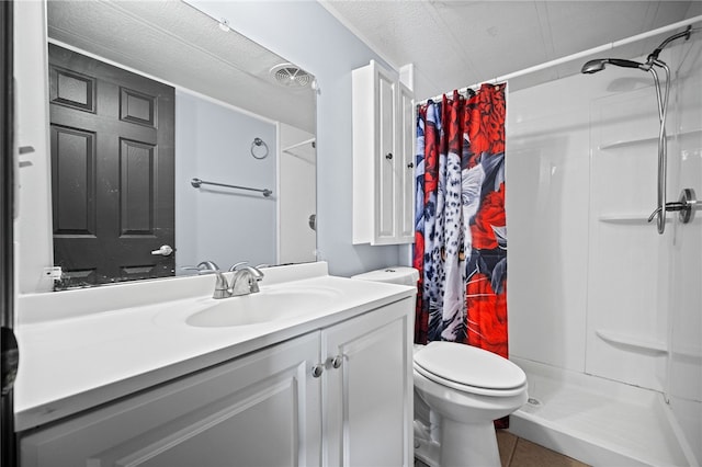 bathroom featuring vanity, tile patterned flooring, a shower with curtain, and a textured ceiling